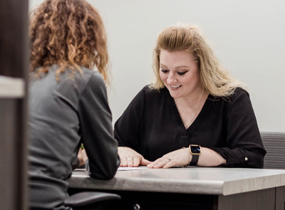 Two people at desk